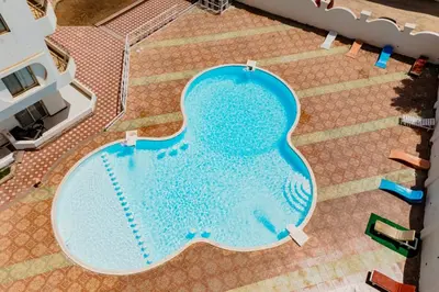 an overhead view of a large swimming pool at Makramia studio in Hurghada
