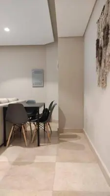 a dining room with a table and chairs at Mangroovy Magic PoolView 1BR in Beachfront Complex M3 3A 13 in Hurghada