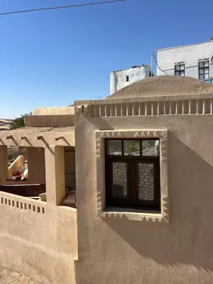 a building with a window on the side of it at Ayujidda Nubian House in Aswan