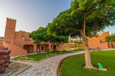 a tree in front of a building at Akassia Swiss Resort in Quseir