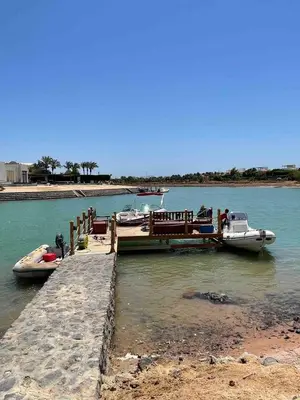 two boats are docked at a dock in the water at Spacious Villa with private pool-Gouna in Hurghada