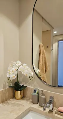 a bathroom with a sink and a mirror at El Gouna Mangroovy Residence Sea View - kitesurfing in Hurghada