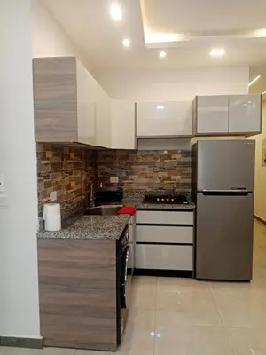 a kitchen with a stainless steel refrigerator and a sink at A216 flat Al Makramia in Hurghada