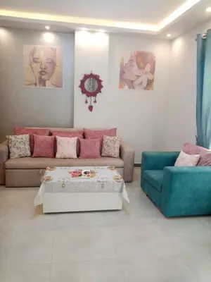 a living room with a couch and a coffee table at A216 flat Al Makramia in Hurghada
