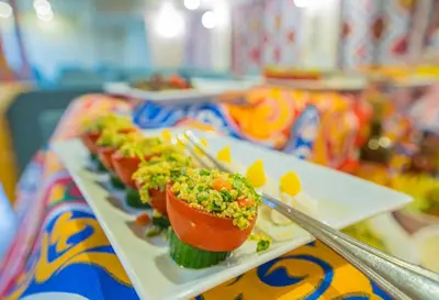a row of plates of food on a table at 4-Day 3-Night Guided Nile Cruise from Aswan to Luxor every Monday, Wednesday & Friday Departures in Aswan