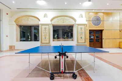 a blue ping pong table in the middle of a room at Siva Golden Bay Makadi in Hurghada