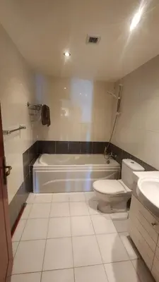 a bathroom with a tub and a toilet and a sink at apartment 2 bedrooms in the view in Hurghada