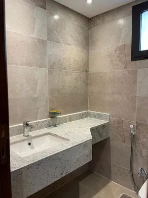 a bathroom with a sink and a shower at شقه بغرفه نوم في الغردقه in Hurghada