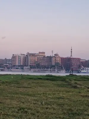 a view of a city with a river and buildings at Djorf apartments in Al Aqālitah