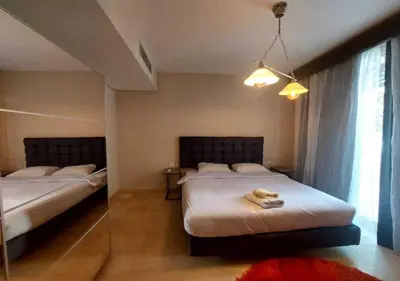 a bedroom with two beds and a window at Warm 1BR with at Mangroovy, El-Gouna M1-7B in Hurghada