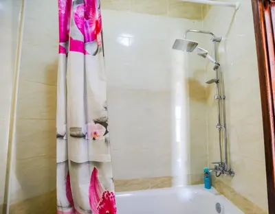 a shower curtain in a bathroom with a tub at la bonita studio in Hurghada