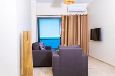 a living room with a couch and a window at Felfela View in Hurghada