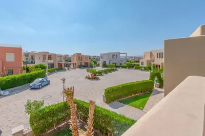 a view of a courtyard with a car parked in it at Elegant 4BR in Tawila, Gouna. Private Pool, Lagoon in Hurghada