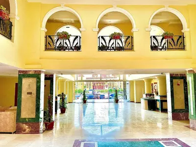 an empty lobby of a building with plants on the windows at Top floor premier view chalet in Red sea Hurghada in Hurghada