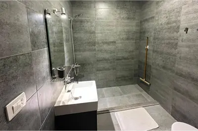 a bathroom with a sink and a shower at Imperial Resort Apt Sleeps 3 - Pool Parking Wifi in Hurghada