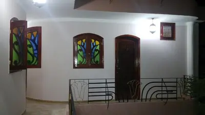 a room with three stained glass windows on the wall at Pyramids Luxor Hotel & SPA in Luxor