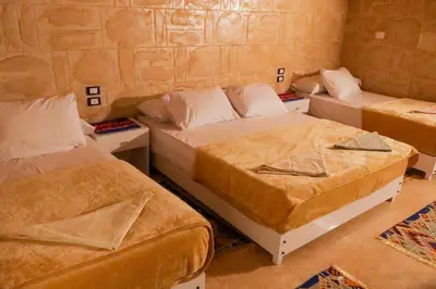 a room with two beds in a room at Nubian Hights guesthouse in Shellal