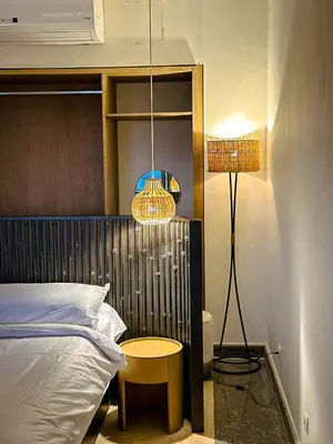 a bedroom with a bed and a table and a lamp at The Zen Wellness Resort in Aswan