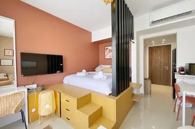 a bedroom with a bed and a tv in it at The Snuggly Studio G Cribs El Gouna in Hurghada
