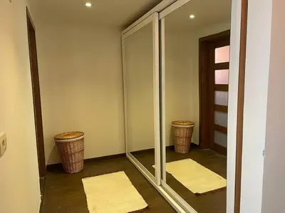 a walk in closet with mirrors and two baskets at Baywest Villa, Somabay in Safaga
