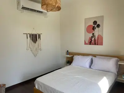 a bedroom with a bed in a white room at Baywest Villa, Somabay in Safaga