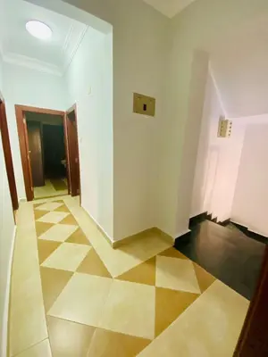 an empty room with a tile floor and a hallway at Villa 6 in Hurghada