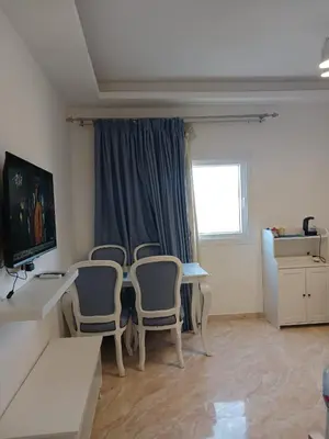 a room with a table and chairs and a window at Selena Bay Resort & beach in Hurghada