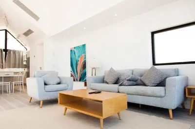 a living room with a couch and two chairs at Modern Soma Bay 2BR Villa w sea views, beach & pool access in Hurghada