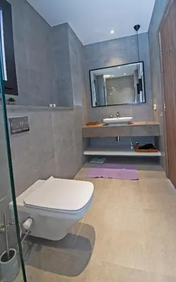 a bathroom with a toilet and a sink at Ollystays Fanadir Marina 1BR Heated Jacuzzi in Hurghada