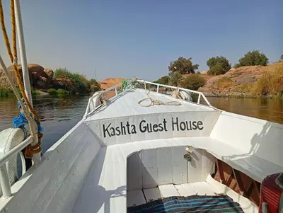 a boat with the name of a ksticica guest house at Kashta Nubian Guest Houst in Aswan