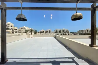 a view from the roof of a building with two lights at Captivating 1 BDR Fanadir Marina in Hurghada