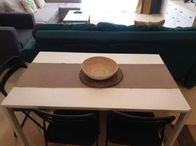 a table with a bowl on it in a living room at Mangroovy - Divine 1BR Hotel view in Hurghada