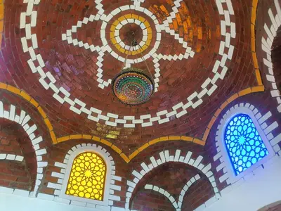 a mosaic ceiling of a building with stained glass windows at Shahhat Flat in Luxor
