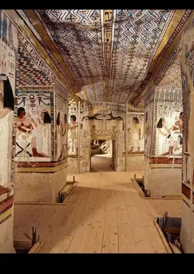 a large room with a ceiling and paintings on the walls at Shahhat Flat in Luxor