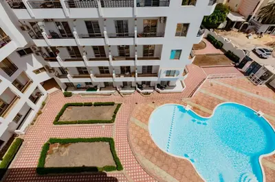an overhead view of a building with a swimming pool at Al makramia Compound in Hurghada