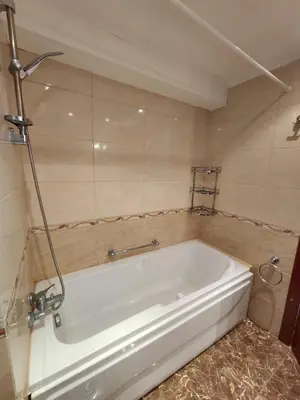 a white bath tub in a bathroom with at apartment in hurghada307 in Hurghada