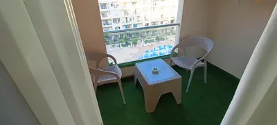 a room with a table and chairs and a window at Floranza khamsin hurgada منتجع فلورنزا الغردقه in Hurghada