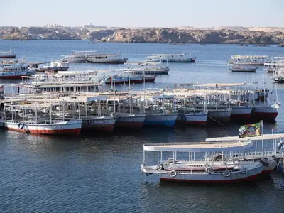 a group of boats docked in a body of water at Endo Mando in Shellal