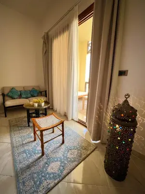 a living room with a couch and a table at luxury Beachfront Studio- Foreign Nationals Only in Hurghada