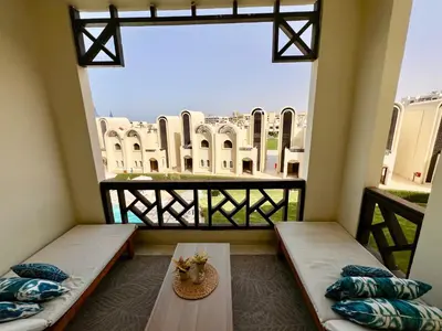 a balcony with two beds and a view of the city at luxury Beachfront Studio- Foreign Nationals Only in Hurghada