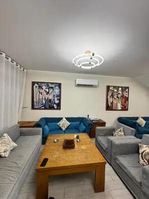 a living room with a couch and a coffee table at Bali c 3 D in Hurghada