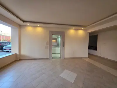 a large empty room with a view of a parking lot at ALDau Heights Koka in Hurghada