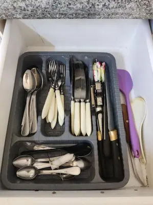 a tray filled with utensils in a drawer at Studio Cleopatra Resort in Hurghada