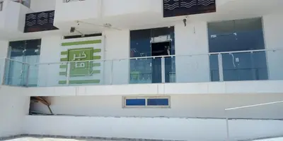 a building with windows and signs on the side of it at Tibaview in Hurghada