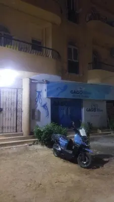 a motorcycle parked in front of a building at Hurghada City Apartment1 in Hurghada