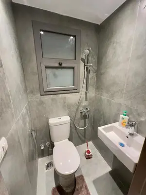 a bathroom with a toilet and a sink at Luxury Villa Bali Al Gouna Hurgh in Hurghada