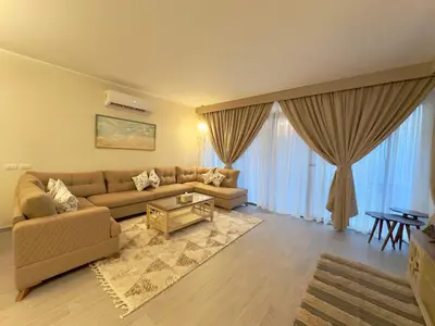 a living room with a couch and a table at Luxury Villa Bali Al Gouna Hurgh in Hurghada