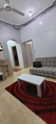 a living room with a couch and a table at Ahmed House 1 in Safaga
