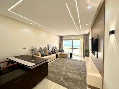 a living room with a couch and a table at The view compound in Hurghada