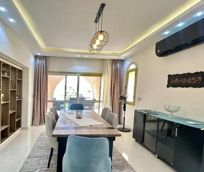 a dining room with a table and chairs at The view compound in Hurghada